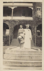 A vintage black and white picture of a woman graduating